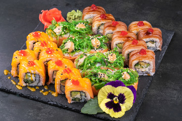 japanese sushi food. Maki ands rolls with tuna, salmon, shrimp, crab and avocado.
