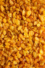 Golden Raisins background, top view.
