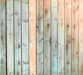 wooden old fence of soft blue and orange colors.
