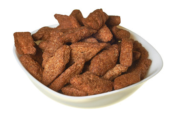 Full bowl of spicy hard chuck from brown bread isolated on white background