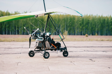 Paraglider taking selfies while take-off.