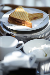 Sandwich in the Mediterranean breakfast in the sun layout on the white plate 