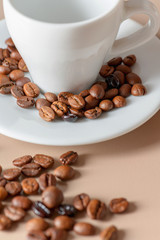 Roasted coffee beans and cup close-up. Roasted coffee beans of the morning mood.