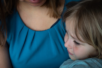 sad crying little girl hugging mother, kids anxiety and stress