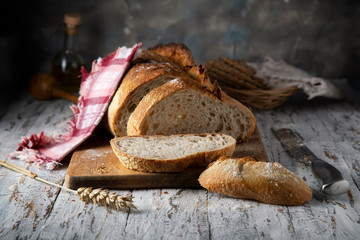 Sliced ​​fresh bread on a wooden table