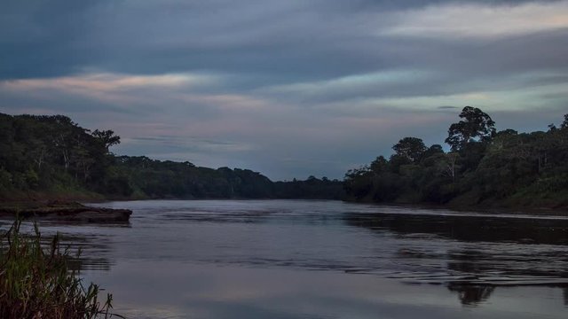 sunset time lapse of river in the amazon rainforest