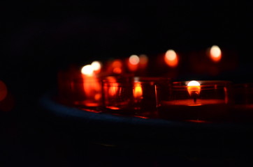 Many burning candles with shallow depth of field