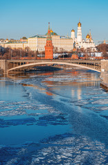 Classic view of the Moscow Kremlin. View from the Patriarchal bridge. Moscow river in ice.