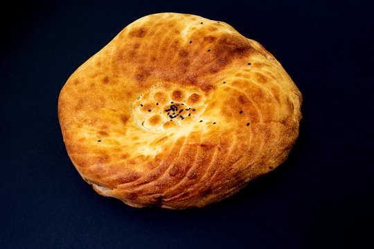 Traditional Asian tortilla on a black isolated background