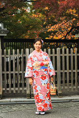 Asian beautiful woman  dressing kimono and sightseeing around japanese old house in Kyoto, Japan