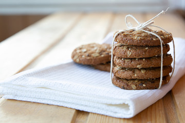 oatmeal cookies with a glass of milk on a wooden table