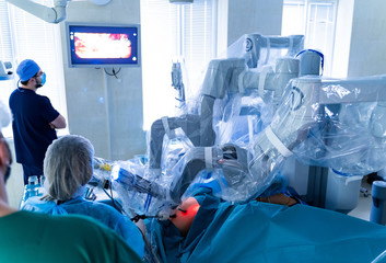 Robotic surgery. Medical team performing operation. Minimally invasive robotic surgery.