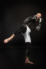 Mixed Martial Arts Fighter Against Dark Background