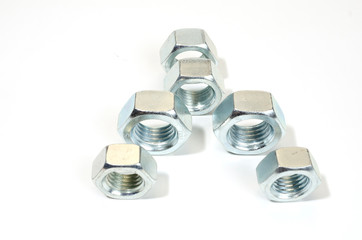 group of new, shiny big nuts on white.