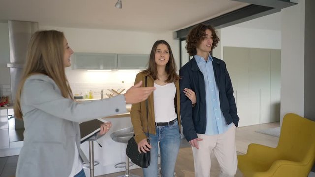 Young couple visiting modern apartment