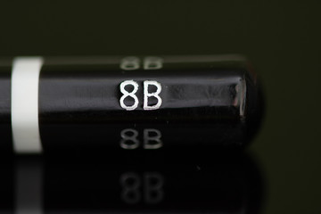 black  8B pencil in high resolution isolated on black background