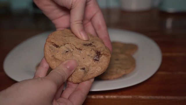 Chocolate chip cookie slow motion breaking open