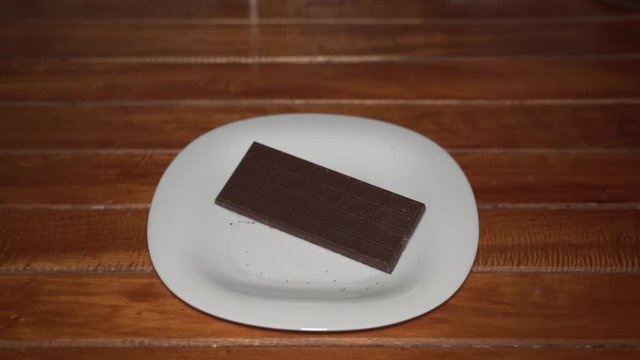 Chocolate bar for cooking in wooden table