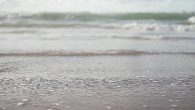 calm sea waves at beach filmed in 120fps.
