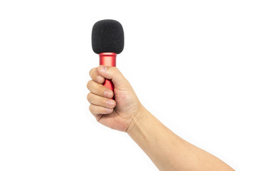 One hand holding a small red microphone