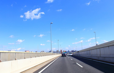 Fototapeta na wymiar Car driving on metropolitan expressway