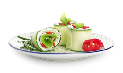 Plate with tasty cucumber rolls on white background
