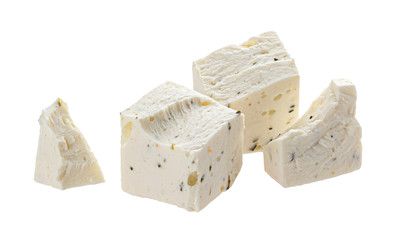 Greek feta pieces with herbs and spices isolated on white background
