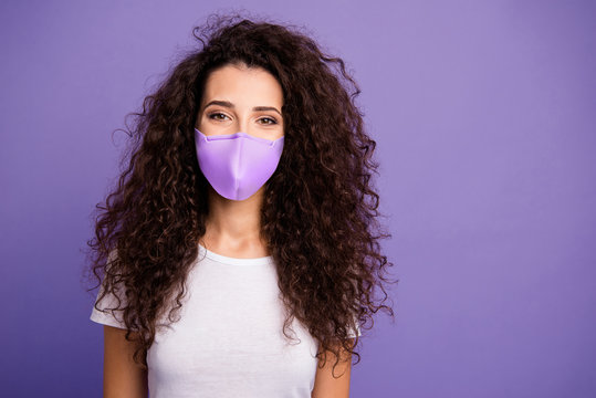 Close up photo beautiful modern minded lady long wave wealth hair good mood wear casual white t-shirt clothes protect facial mask isolated violet purple bright background