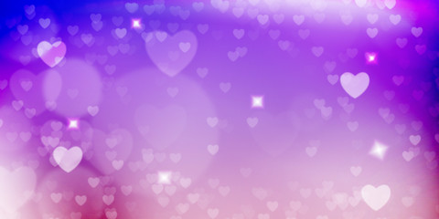Glowing  pink and purple bokeh background.  Spring concept.  Blurred bokeh circles and hearth shapes.
