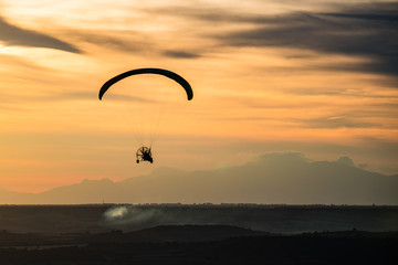 Paragliding with sunset sky with motor