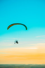 Paragliding with sunset sky with motor