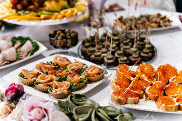 Food on the table, red caviar sandwiches