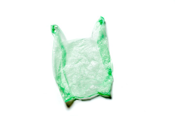 Empty plastic green bag isolated on white