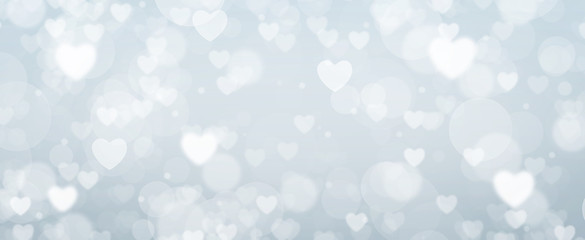 Glowing soft blue bokeh background. Spring concept. Blurred bokeh circles and hearth shapes.