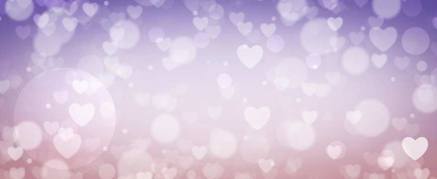 Glowing purple and pink bokeh background. Spring concept. Blurred bokeh circles and hearth shapes.