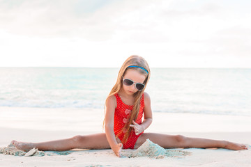 Cute little girl at beach during caribbean vacation