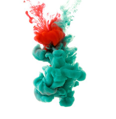 Paint in the water. Abstract ink in water on white background. Watercolor ink in water on a white background. A powerful explosion of green color.