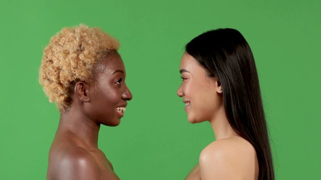Beautiful Girls Asian and Black African American Beautiful Sexy young womens with Natural Healthy Skin Smiling.Makeup application. Racial equality