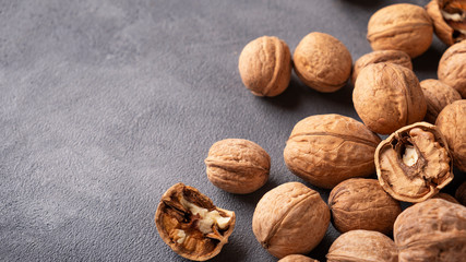 Walnut on gray background with copy space. Walnut background with text space