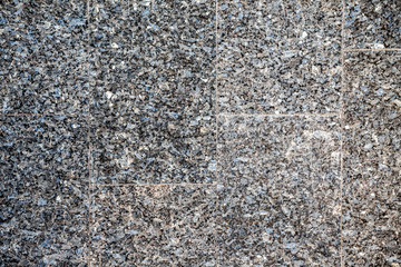 dark granite tiles in small gravel