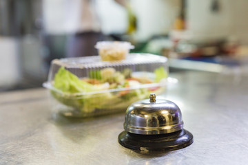 cooking in a restaurant and packing in a container for delivery