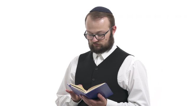 Jewish man turning pages while reading Torah. Hebrew Bible reading. Isolated, on white background