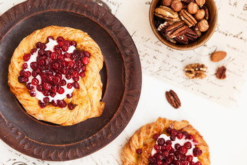 tartlet with berries, sweet pastries on a white table, pastry shop.