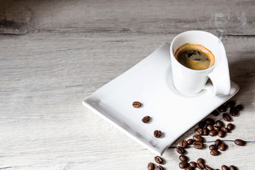 cup of coffee. coffee beans on the table
