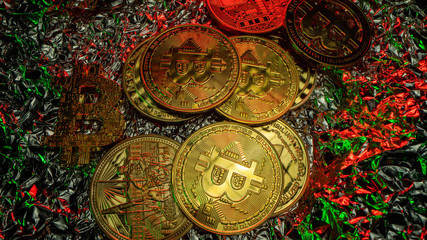 Many crypto coins on the table with nice reflections. Green and red light. Top view
