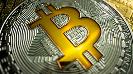 Super MACRO shot of silver BITCOIN BTC. Top view shot