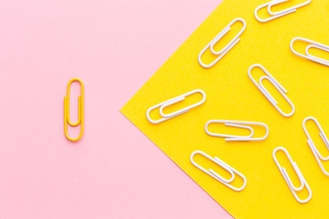 Flat lay paper clip. Outstanding, choice and difference concept. Being unique and individuality.