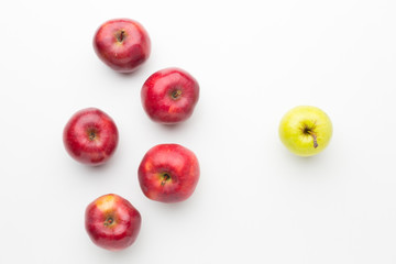 Flat lay apples aligned on table. Outstanding, choice and difference concept. Being unique and individuality.