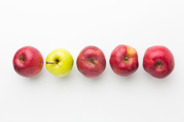 Top view apples aligned. Outstanding, choice and difference concept. Being unique and individuality.