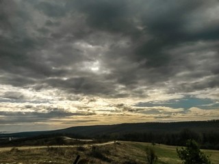 stormy clouds over green forest in summer season